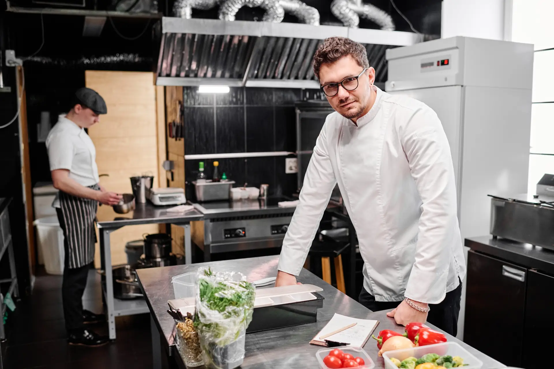 Chef standing at commercial kitchen